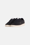 Dark green suede sneakers by Lyle & Scott with white rubber soles and tonal bird logo, front view