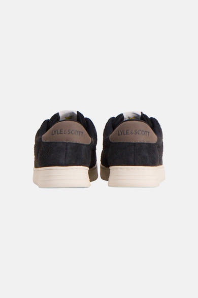 Dark green suede sneakers by Lyle & Scott, back view with cream rubber soles and branded heel tabs