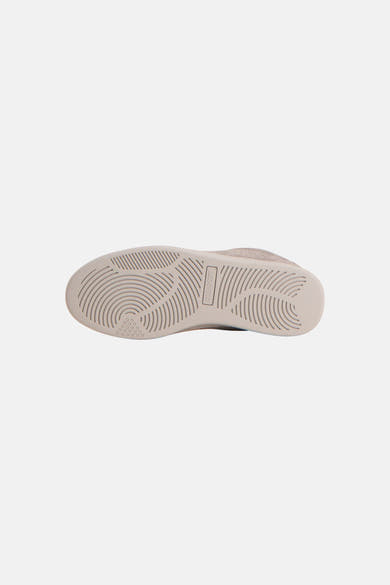 Beige suede sneakers by Byle&Scott, bottom view showing textured rubber sole with circular tread pattern and brand logo.