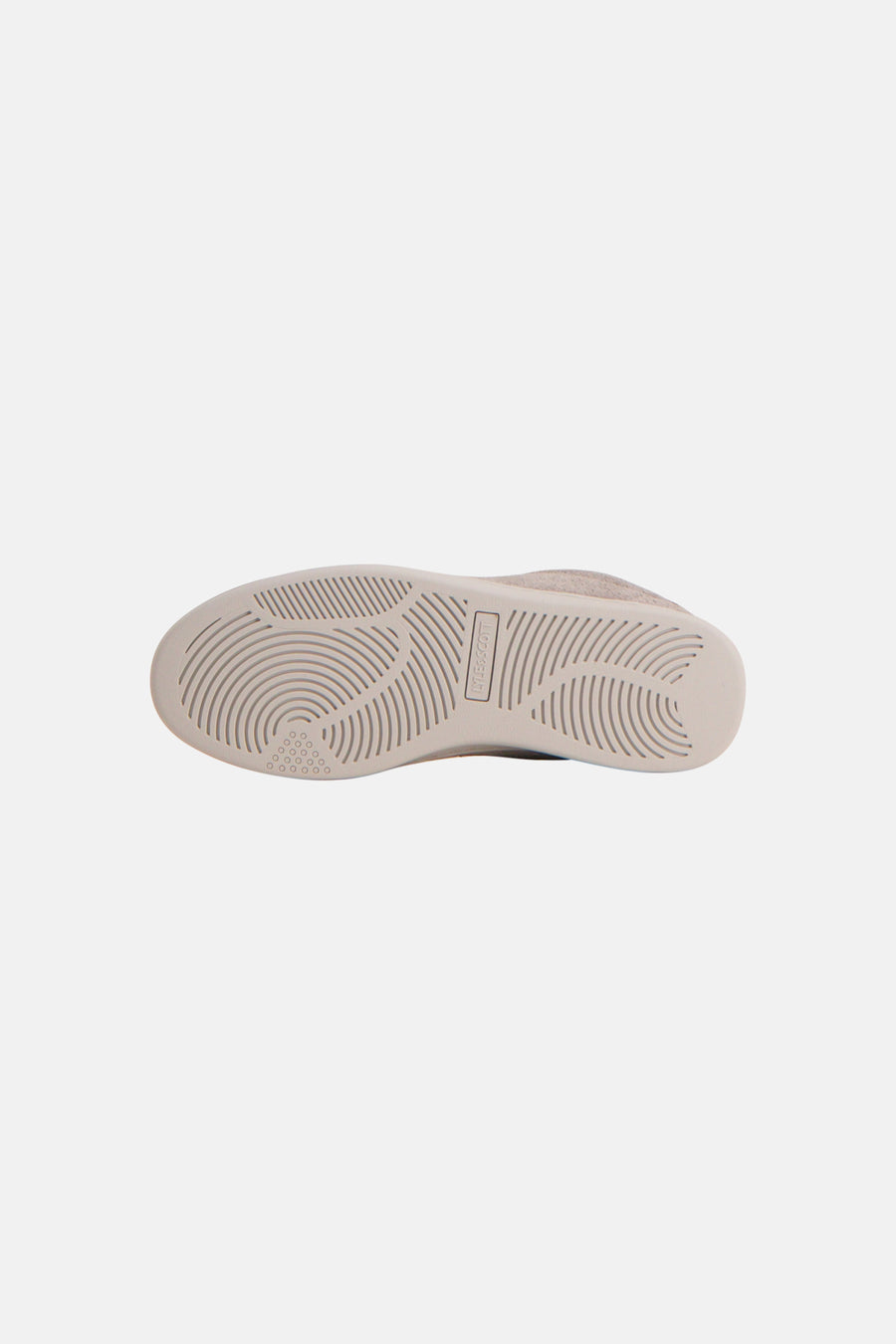Beige suede sneakers by Byle&Scott, bottom view showing textured rubber sole with circular tread pattern and brand logo.