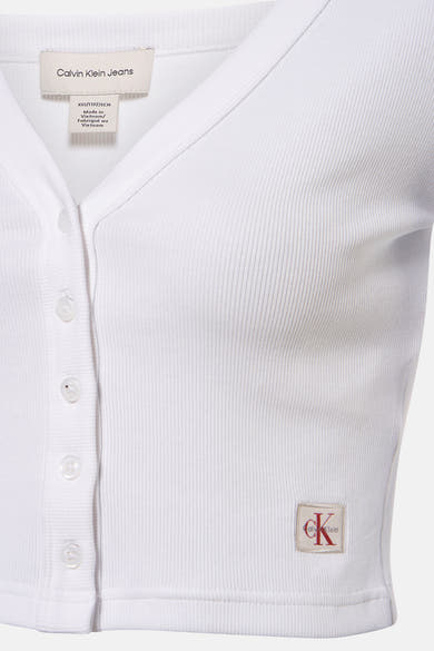 Wit T-shirt met lange mouwen van Calvin Klein, in geribbelde stof met knoopsluiting en discreet logo.