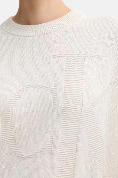 Beige rondehals sweatshirt van Calvin Klein, met het merklogo in een toon-op-toon patroon.