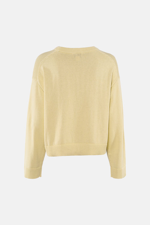 Pull à col rond jaune de Calvin Klein, avec des manches longues et une texture tricotée, vue de dos.
