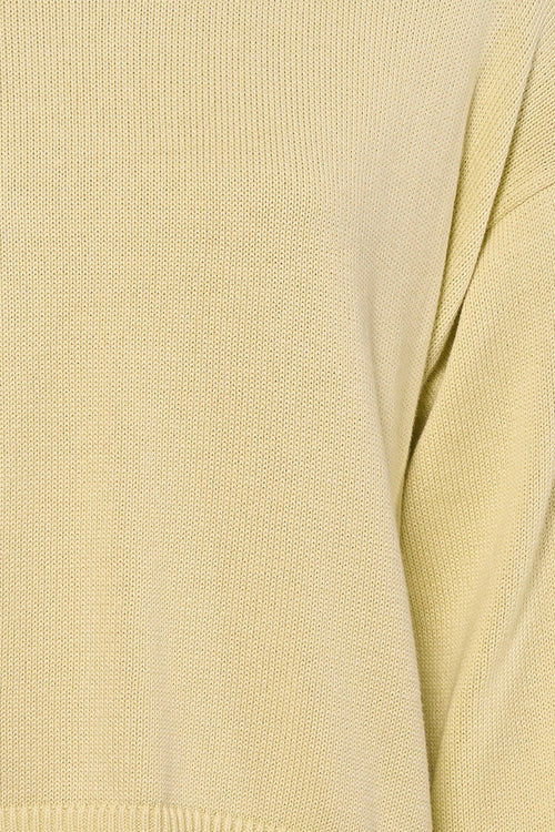 Pull à col rond jaune de Calvin Klein, en tricot texturé, détail du vêtement.