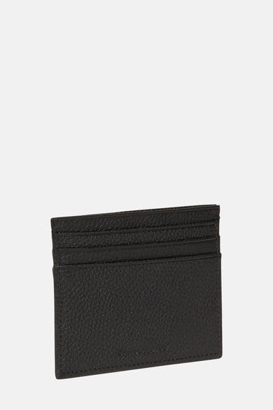 Porte-monnaie noir de Calvin Klein avec une texture grainée et plusieurs fentes pour cartes.