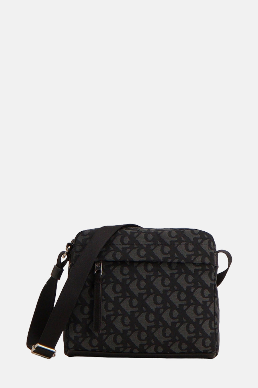 Sac à bandoulière noir de Calvin Klein avec motif imprimé monogramme sur l'ensemble.