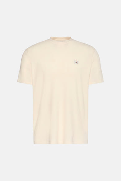 T-shirt à manches courtes jaune van Calvin Klein avec un motif texturé gaufré.