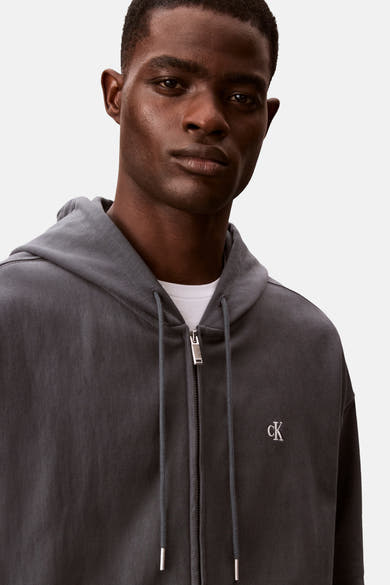 Blauwe Calvin Klein bodywarmer met ritssluiting en geborduurd logo.