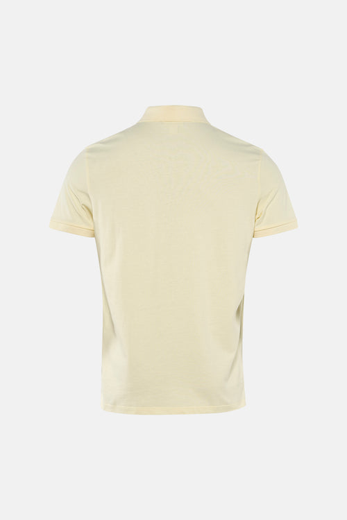 Polo à manches courtes jaune de Calvin Klein, vue arrière sur fond neutre.