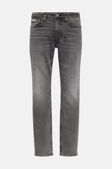 Grijze slim fit jeans van Calvin Klein in denim met subtiele verkleuring op de dijen.