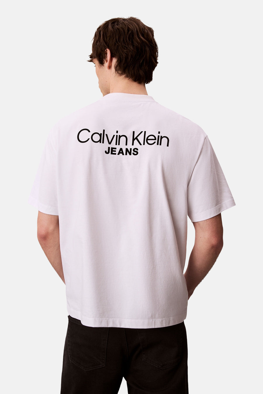 Wit T-shirt met korte mouwen van Calvin Klein, met logo op de rug gedrukt.