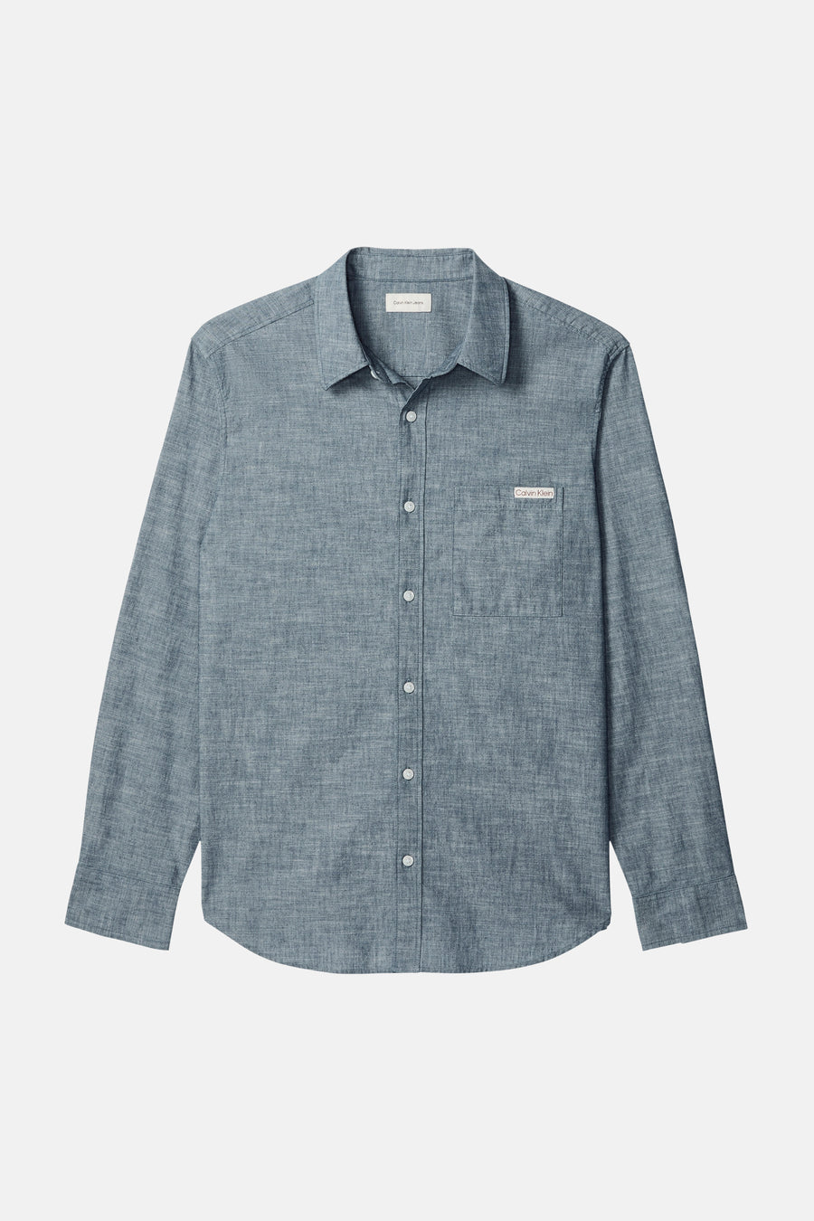 Chemise bleu à manches longues de Calvin Klein avec une poche poitrine boutonnée et une texture subtile.
