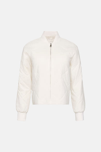 Veste courte écru de Calvin Klein avec motif matelassé en losange et fermeture éclair argentée.