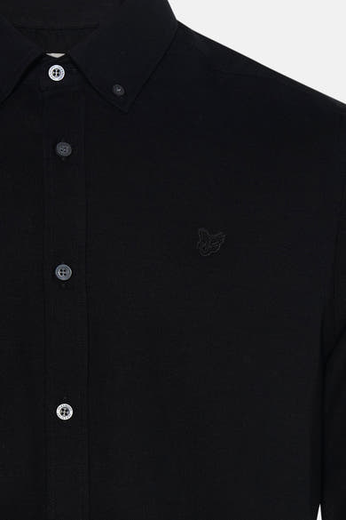 Black long-sleeve shirt with textured fabric and subtle butterfly embroidery, featuring branded buttons, close-up front view