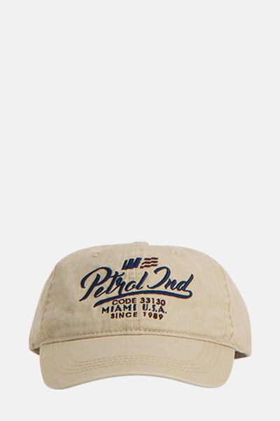 Casquette beige de Petrol Industries, avec broderie bleu marine 'Petrol Ind', 'Miami USA', 'Since 1989'.
