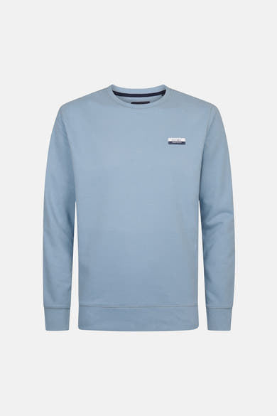 Sweat bleu de Petrol Industries, avec un logo discret sur la poitrine.