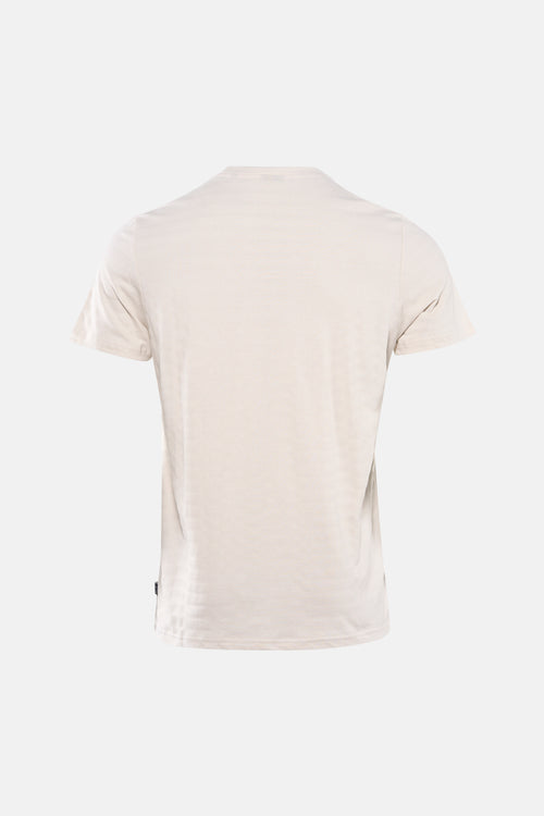 T-shirt beige à manches courtes de Petrol Industries, uni avec une petite étiquette sur le côté.