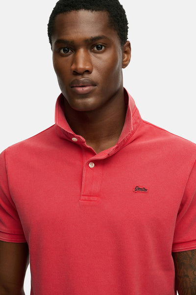 Roze poloshirt met korte mouwen van SUPERDRY, van getextureerd katoen met discreet logo op de borst.