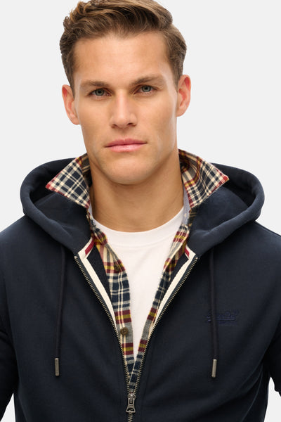 Donkerblauwe bodywarmer van SUPERDRY, met geribde capuchon en zichtbare ritssluiting.