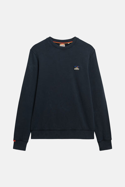 Marineblauwe SUPERDRY-sweatshirt met een klein vierkant logo op de borst.
