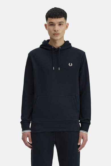 Sweat à capuche bleu foncé de FRED PERRY, avec cordon de serrage, poche kangourou et logo sur la poitrine.