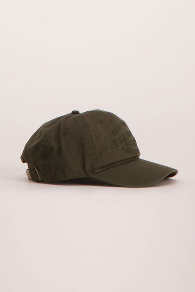 Olive green baseball cap with tonal embroidered logo, side view, structured crown and curved brim