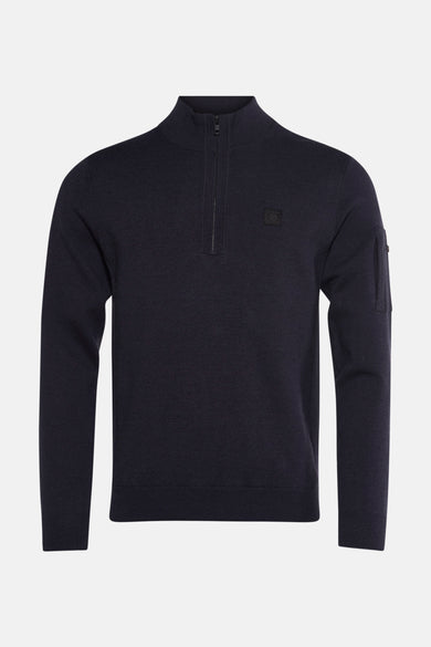 Pull à col roulé bleu marine de Petrol Industries, avec fermeture éclair et poche sur la manche.