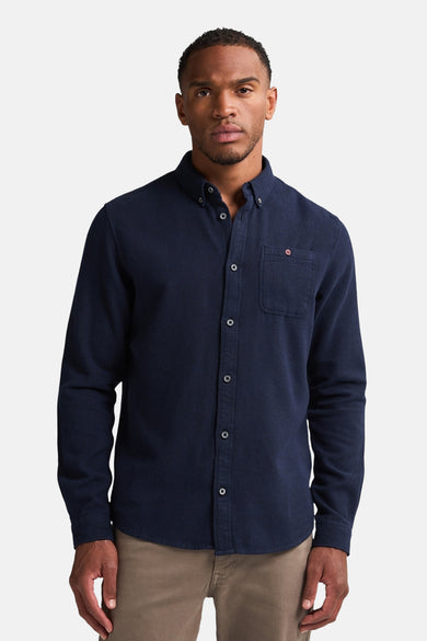 Chemise à manches longues bleue de Petrol Industries, avec poche poitrine et boutons apparents.