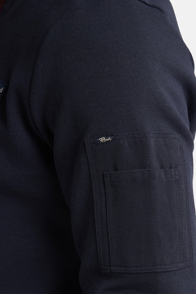 Blauwe sweater van Petrol Industries, met een opgestikte borstzak en een zachte textuur.