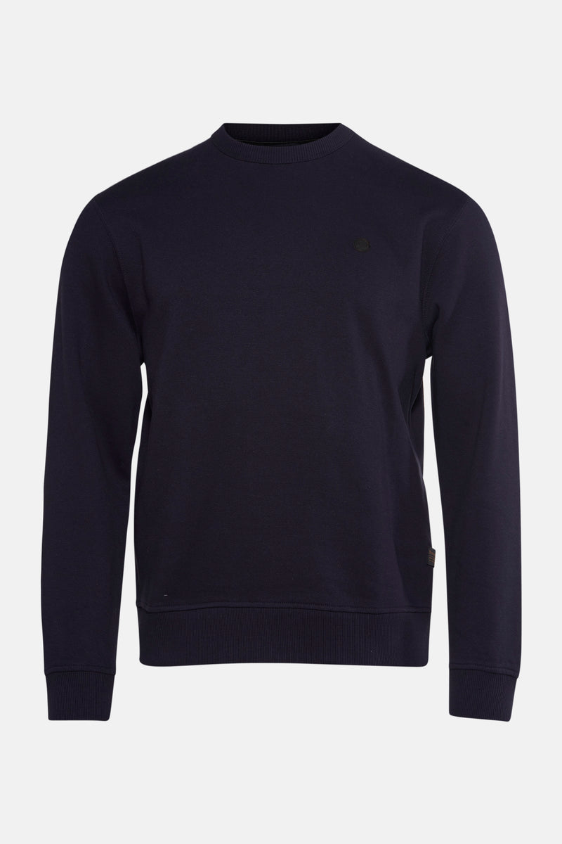 Ronde hals trui blauw van Petrol Industries met een klein logo op de borst.