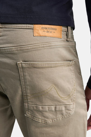 Khaki men's 5-pocket seasonal pants by Petrol Industries, back view with leather brand patch and stitched pocket detail