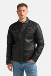 Black denim vest by Petrolind, front view with zip closure, chest pockets, and brand patches, worn with blue jeans.