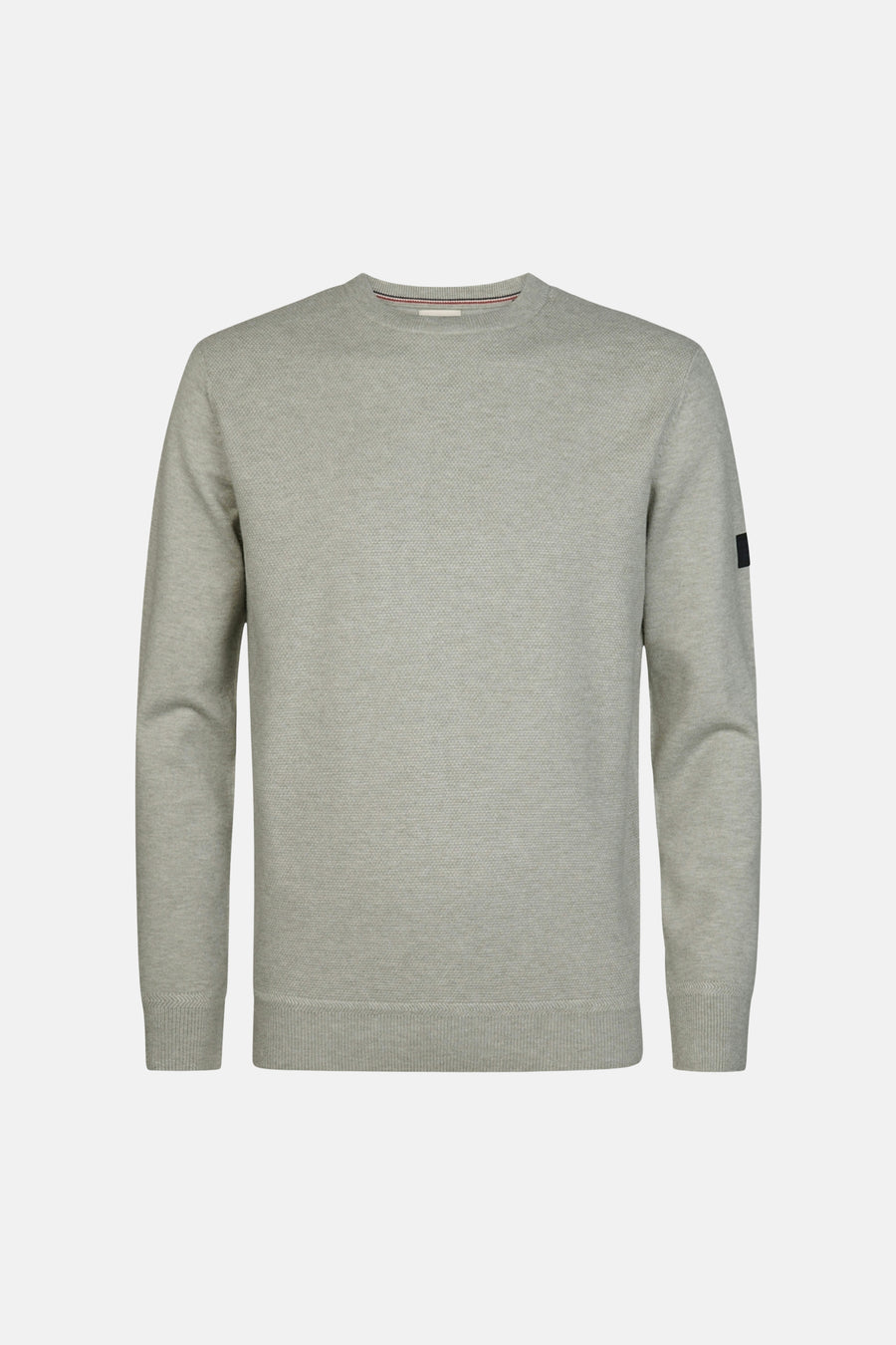 Grey crewneck sweater with textured knit, ribbed cuffs and hem, small black patch on sleeve, front view