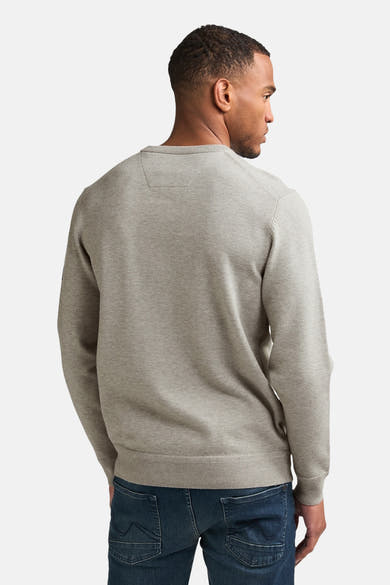 Grey crewneck sweater with ribbed cuffs and hem, back view on model wearing dark jeans