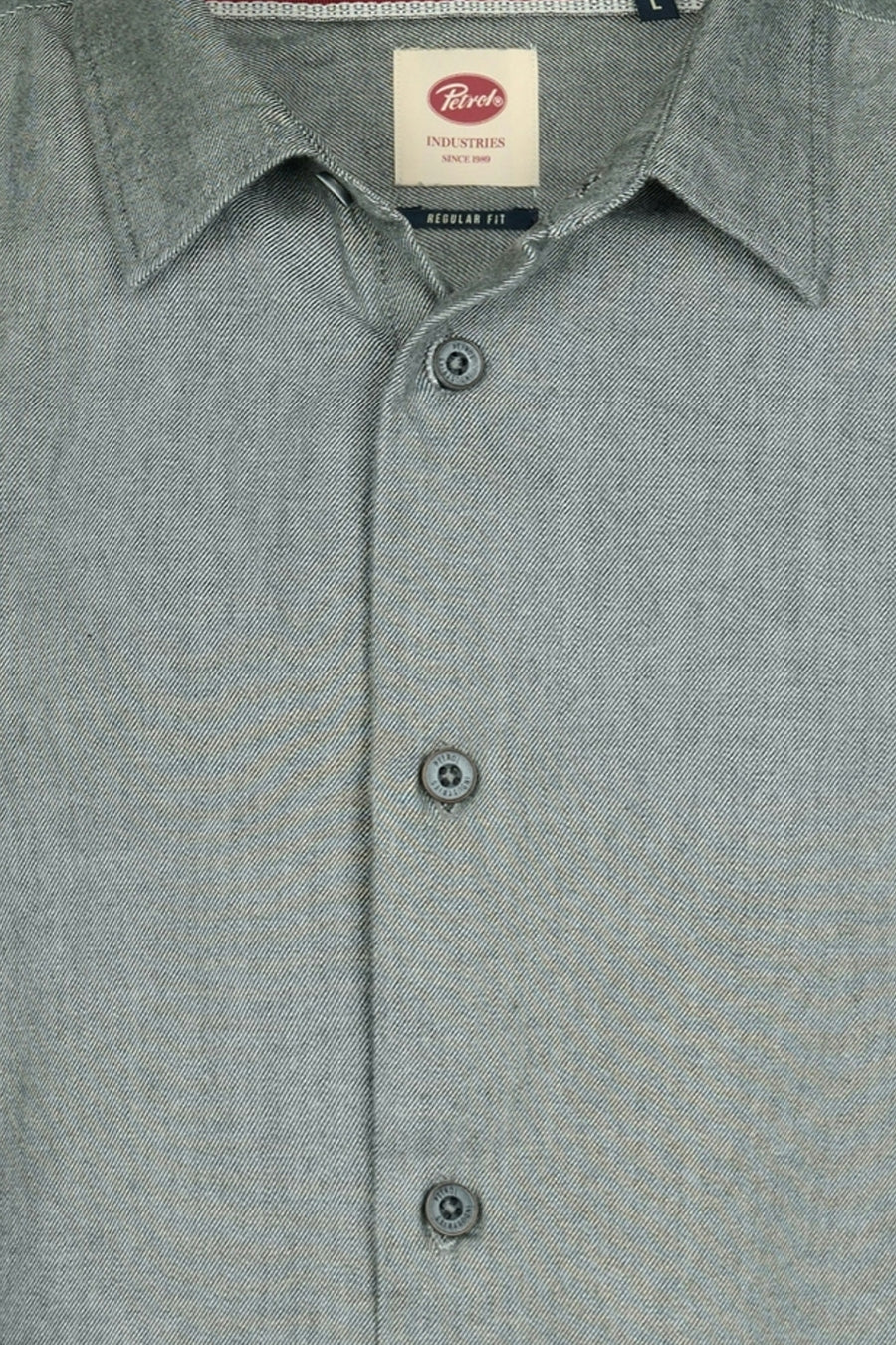 Green long-sleeve shirt by Petek with textured fabric, button-down front, and classic collar, close-up view