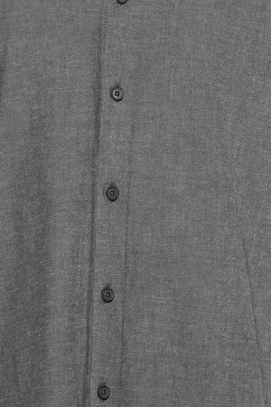 Green long-sleeve shirt with textured fabric and dark buttons, front close-up view