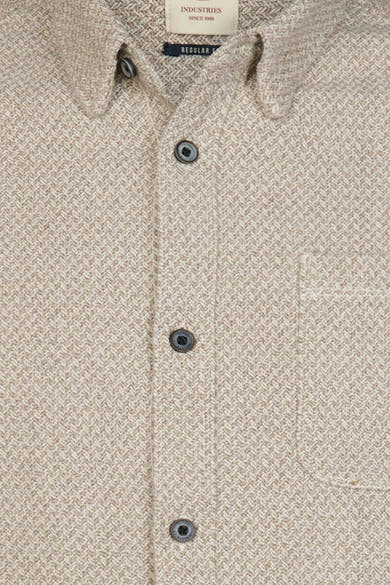 Beige long-sleeve shirt with herringbone texture and chest pocket, by Industries, featuring dark buttons and collar detail, close-up front view