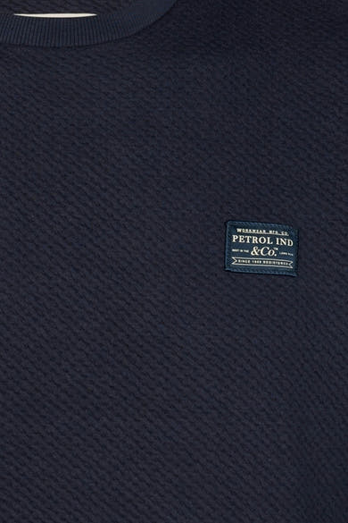 Navy blue ribbed crewneck sweatshirt by Petrol Ind & Co. with textured weave and branded patch on chest, close-up view