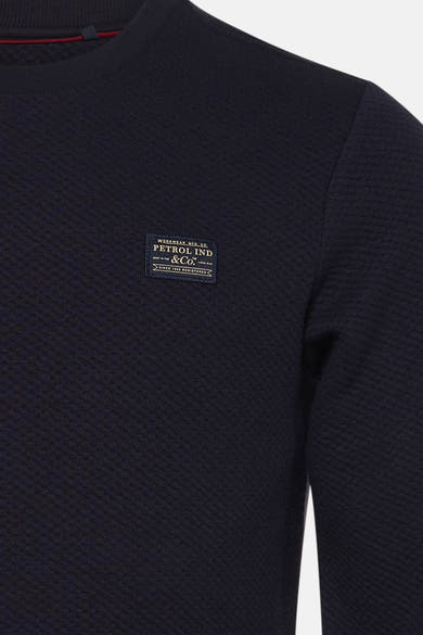 Navy blue textured crewneck sweatshirt by Petrol Ind & Co. with ribbed collar and chest patch label, close-up front view
