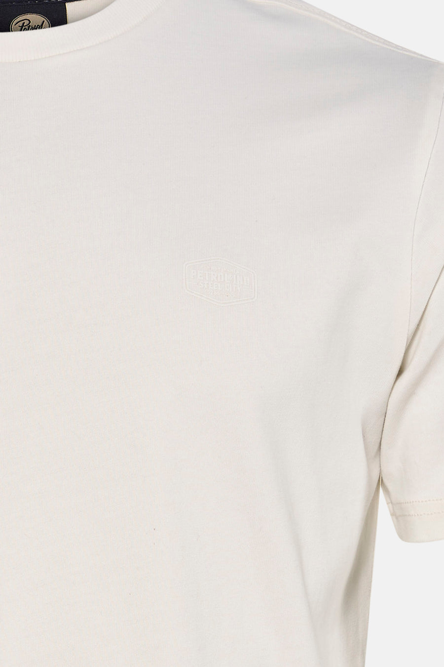Ecru short-sleeve t-shirt by Petrolind with subtle embossed logo on chest, close-up front view