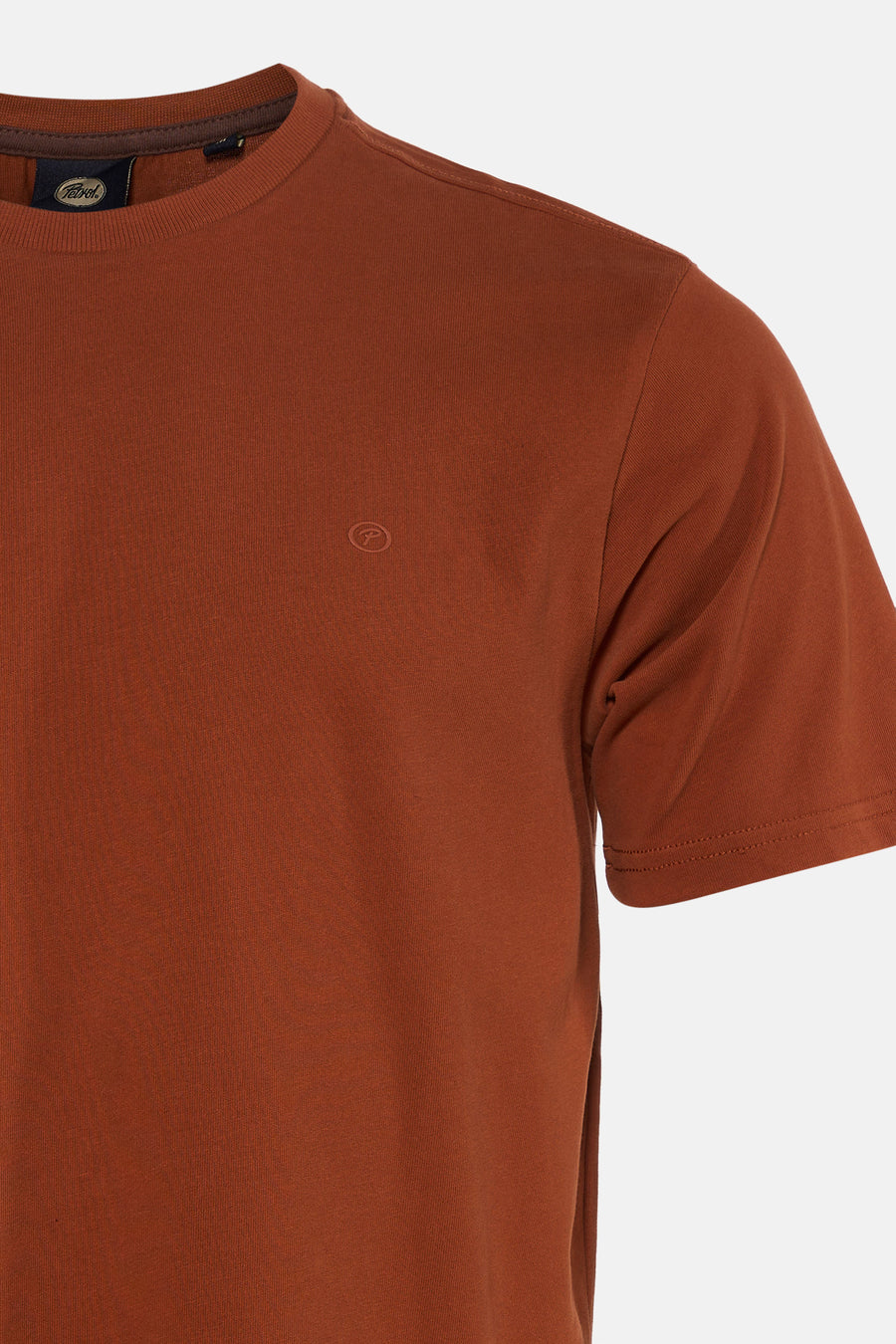 Orange short-sleeve t-shirt by Petrol, featuring ribbed crew neck and small tonal logo on chest, close-up side view