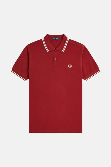 Rode polo met korte mouwen van FRED PERRY, met witte biesjes op de kraag en mouwen, geborduurd logo.