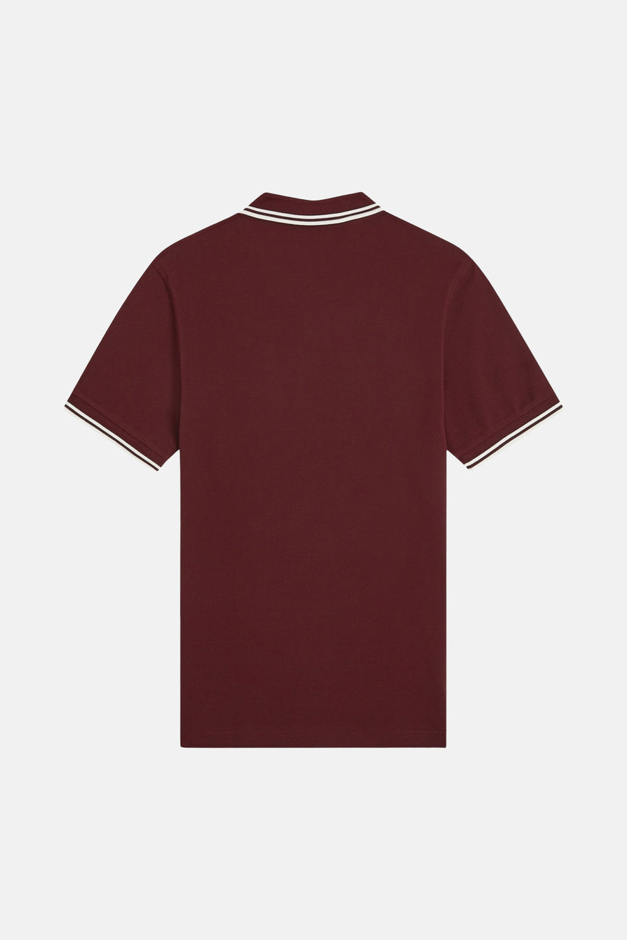 Polo bordeaux à manches courtes de FRED PERRY, avec rayures blanches au col et aux manches.