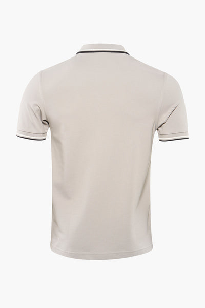 Grey polo shirt with ribbed collar and sleeve cuffs featuring black and white stripes, back view, pique texture