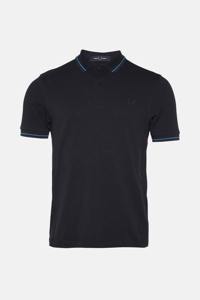 Polo bleu marine de Fred Perry avec finitions rayées aux manches et au col.