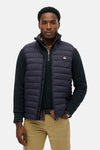 Blauwe mouwloze jas van Superdry, met centrale ritssluiting en zakken met rits.