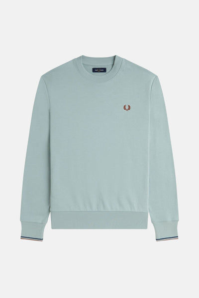 Sweat-shirt bleu de FRED PERRY avec logo brodé sur la poitrine et bordure rayée aux poignets.