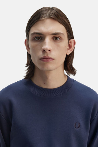 Sweat-shirt bleu de FRED PERRY avec un logo brodé sur la poitrine.