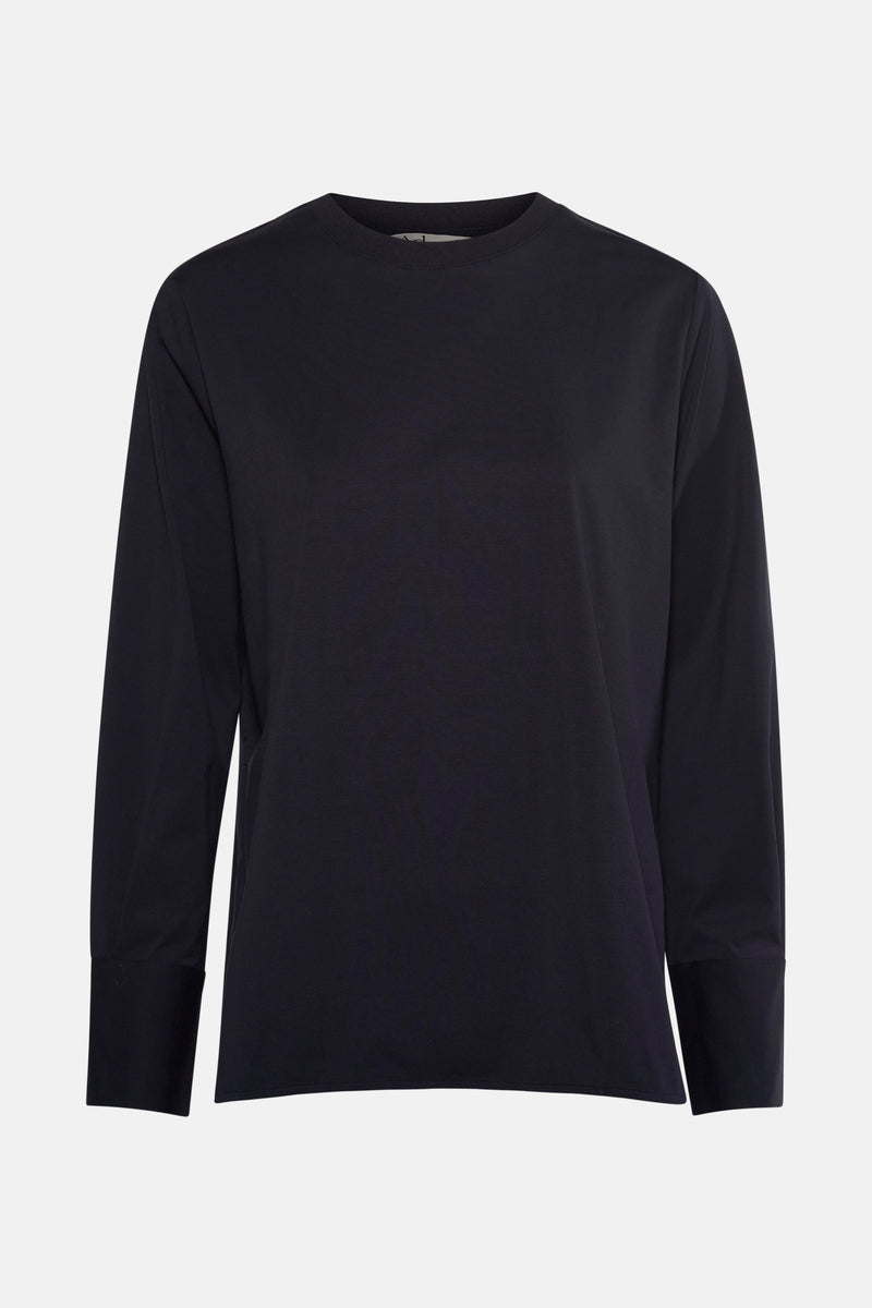 Blauwe T-shirt met lange mouwen van ADORE, met rechte manchetten en effen achtergrond.
