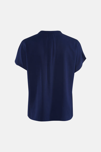 Chemisier bleu à manches courtes de MEXX, avec un col dégagé et une texture subtile.